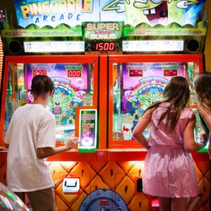 Kids playing arcade games at Fiesta Village