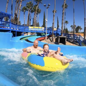 Dad and Daughter on a water slide