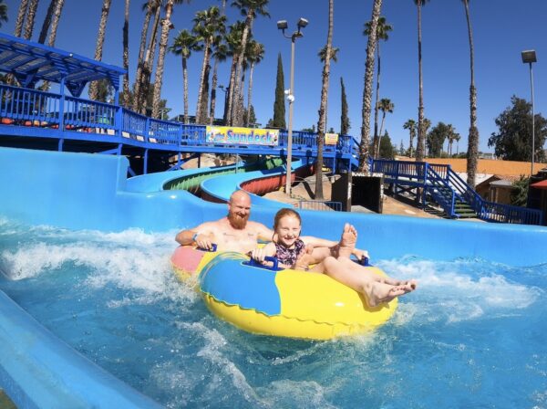 Dad and Daughter on a water slide